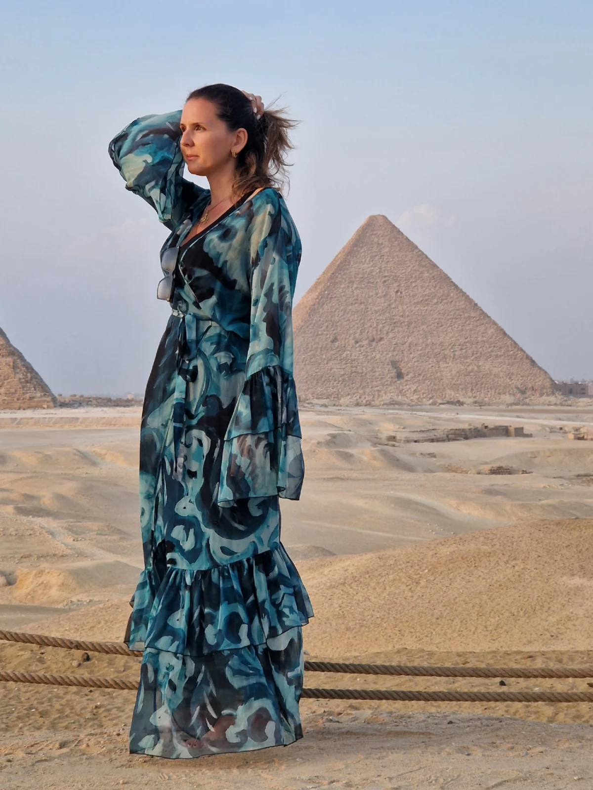 Loukia Papa standing barefoot before the Great Pyramid of Giza
