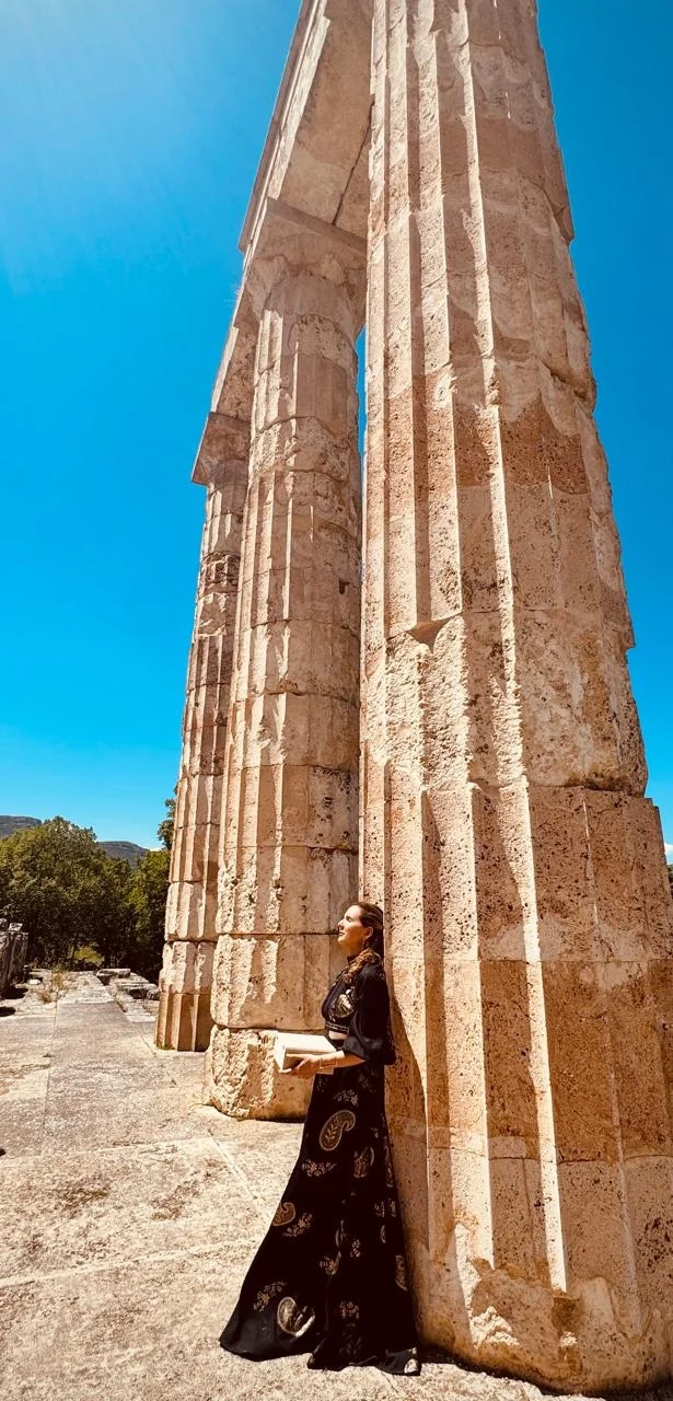Loukia Papa leaning on a column of the Temple of Zeus at Nemea