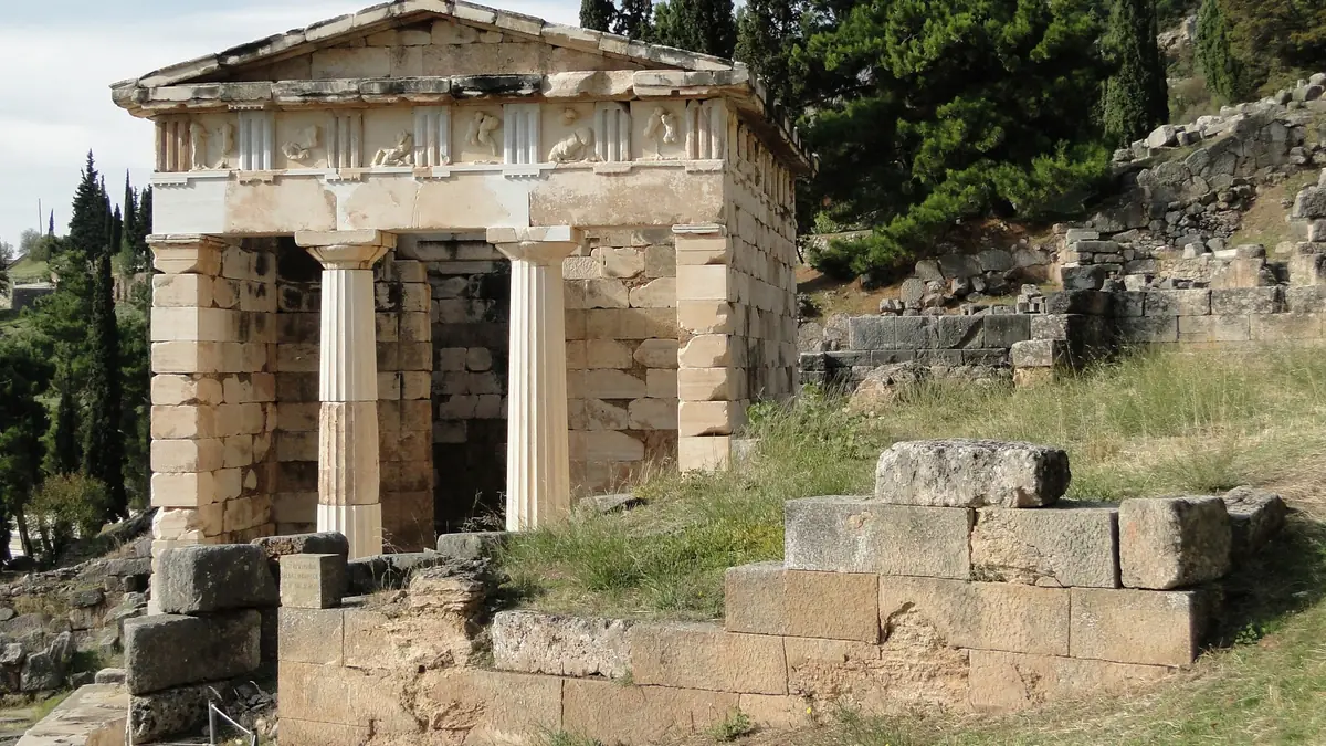 The Treasury of the Athenians among the cypresses of Delphi