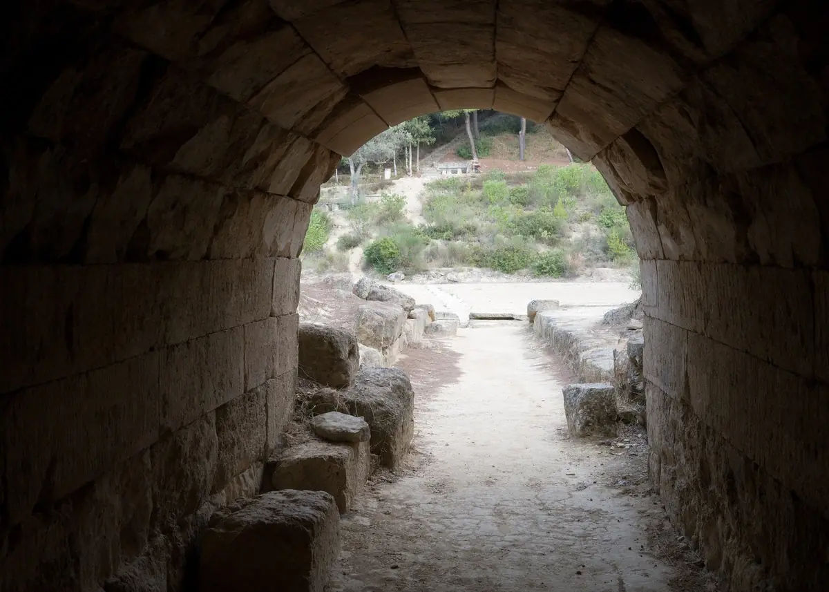 Looking out from the vaulted tunnel into the ancient stadium of Nemea